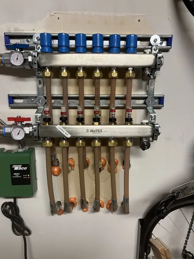 Plumber performing Water Heater Repair at a residential property in Pikesville